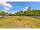 Fenced dog park with agility equipment and shaded seating area at 12196 Alachua Ln, Venice, FL 34293