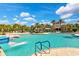 Large community pool with a waterslide and cabanas at 12196 Alachua Ln, Venice, FL 34293