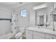 Clean bathroom with shower/tub combo and window at 12196 Alachua Ln, Venice, FL 34293