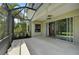Screened patio with sliding glass doors leading to the interior of the home at 12196 Alachua Ln, Venice, FL 34293