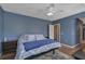 Primary bedroom with large bed and ensuite bathroom access at 12196 Alachua Ln, Venice, FL 34293