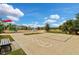 Playground with a hopscotch court and a nearby bench at 12196 Alachua Ln, Venice, FL 34293