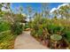 Pathway to canoe and kayak launch with racks for storing equipment at 12196 Alachua Ln, Venice, FL 34293