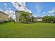 Two story home showcasing a large backyard at 12196 Alachua Ln, Venice, FL 34293