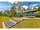 Outdoor kayak and canoe storage racks with steps leading up to them at 12196 Alachua Ln, Venice, FL 34293