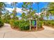 Curved nature trail with a map showing walking paths through lush Florida landscape at 12196 Alachua Ln, Venice, FL 34293