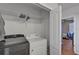Laundry room with washer, dryer, and closet at 12196 Alachua Ln, Venice, FL 34293
