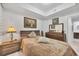 Bedroom with a double bed, dresser, and large mirror at 200 Gardens Edge Dr # 213, Venice, FL 34285