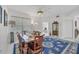 Elegant dining area featuring a wooden table and access to other rooms at 200 Gardens Edge Dr # 213, Venice, FL 34285