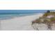 Expansive beach with white sand and calm ocean waves at 200 Gardens Edge Dr # 213, Venice, FL 34285