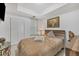 Well-lit bedroom with a double bed and wooden nightstands at 200 Gardens Edge Dr # 213, Venice, FL 34285