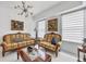 Living room featuring ornate furniture and marble floors at 200 Gardens Edge Dr # 213, Venice, FL 34285