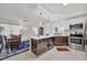 Modern kitchen with stainless steel appliances and island at 200 Gardens Edge Dr # 213, Venice, FL 34285