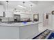 Modern kitchen with stainless steel appliances and an island at 200 Gardens Edge Dr # 213, Venice, FL 34285