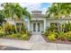 Community building with double doors and landscaping at 200 Gardens Edge Dr # 213, Venice, FL 34285
