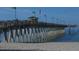 Long pier extending into the ocean with a concession stand at 200 Gardens Edge Dr # 213, Venice, FL 34285