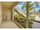 Screened porch overlooking a landscaped courtyard with stairs at 200 Gardens Edge Dr # 213, Venice, FL 34285