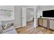 Sitting room with gray sofa and built-in shelving at 19185 Mangieri St, Venice, FL 34293