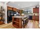 Modern kitchen with granite countertops, stainless steel appliances, and light wood cabinets at 19185 Mangieri St, Venice, FL 34293