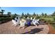 Relaxing fire pit area with comfortable seating, perfect for socializing at 19185 Mangieri St, Venice, FL 34293