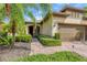 Front entry and garage with landscaping at 19185 Mangieri St, Venice, FL 34293