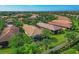 Community overview featuring multiple homes and lush landscaping at 19185 Mangieri St, Venice, FL 34293