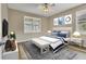 Bright bedroom with a queen-size bed and stylish decor at 19185 Mangieri St, Venice, FL 34293