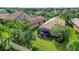 Aerial view showcasing home's backyard and screened patio at 19185 Mangieri St, Venice, FL 34293