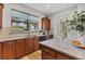 Kitchen sink and counter space with wood cabinets and a view to the backyard at 19185 Mangieri St, Venice, FL 34293