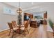 Small dining area with glass table and wicker chairs, adjacent to kitchen at 19185 Mangieri St, Venice, FL 34293