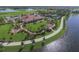 Landscaped grounds with gazebo and fire pit overlooking lake at 19185 Mangieri St, Venice, FL 34293