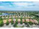 Aerial view of a community with lakefront properties at 19185 Mangieri St, Venice, FL 34293