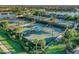 Well-maintained tennis courts surrounded by lush landscaping at 19185 Mangieri St, Venice, FL 34293