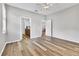 Spacious bedroom with wood-look flooring and access to bathroom at 19185 Mangieri St, Venice, FL 34293