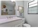 Bright bathroom with updated vanity and fixtures at 1895 Buccaneer Cir, Sarasota, FL 34231