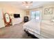 Main bedroom with king-size bed and access to the pool at 1895 Buccaneer Cir, Sarasota, FL 34231