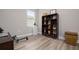 Home office with built-in shelving and a rowing machine at 376 Daylily Blvd, Nokomis, FL 34275