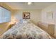 Bedroom with a queen-size bed and dresser at 628 Cervina Dr, Venice, FL 34285