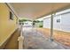 Covered carport with brick pavers and access to home at 628 Cervina Dr, Venice, FL 34285