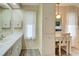 Bathroom with double vanity and linen storage at 628 Cervina Dr, Venice, FL 34285