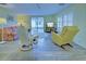 Spacious living room with ample seating and sliding doors to outdoor space at 628 Cervina Dr, Venice, FL 34285