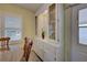Bright dining area with built-in hutch and wood table at 628 Cervina Dr, Venice, FL 34285