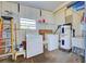 Laundry room with washer, dryer, and storage shelves at 628 Cervina Dr, Venice, FL 34285