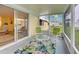 Relaxing screened porch with outdoor furniture and views of the neighborhood at 628 Cervina Dr, Venice, FL 34285