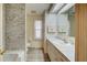 Clean bathroom with a marble-look shower/tub and updated vanity at 628 Cervina Dr, Venice, FL 34285