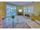 Bright living room with comfy seating, large TV, and sliding glass doors leading to a patio at 628 Cervina Dr, Venice, FL 34285