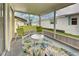 Peaceful screened porch with seating and a view of the surrounding area at 628 Cervina Dr, Venice, FL 34285