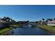 Peaceful canal view with a charming stone bridge at 13091 Borrego St, Venice, FL 34293