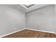 Minimalist bedroom with wood floor and neutral gray paint at 2197 Nita Ter, North Port, FL 34286