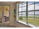 Stunning water and golf course view from bedroom at 6360 Watercrest Way # 203, Lakewood Ranch, FL 34202